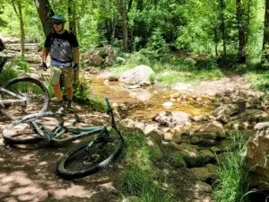 Mountain biker by the creek