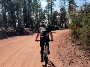 Following a mountain biker on dirt road